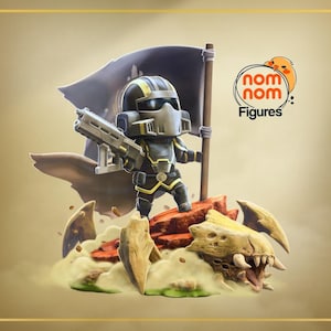 May include: A stylized figurine of a soldier in black and yellow armor holding a rifle and a black flag, standing on a rocky base with a creature skull. The logo "nom nom Figures" with a small orange bird icon is visible in the upper right corner.