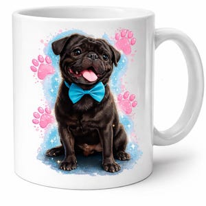 May include: White ceramic mug featuring a black pug wearing a blue bow tie. The pug is set against a blue and pink watercolor background with paw prints. A handle is visible on the right side.