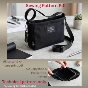May include: A black canvas crossbody bag with an adjustable strap, a top zipper closure, and a rectangular label reading Urban Companion Est 2024. The bag is presented as a sewing pattern PDF with US Letter, A4, and A0 copyshop file formats.