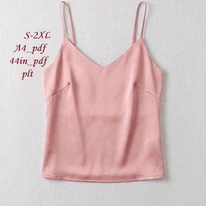 May include: A light pink camisole top with thin spaghetti straps and a V-neckline. The top has a smooth, silky texture. Text on the left side reads "S-2XL", "A4_pdf", "44in_pdf", and "plt".