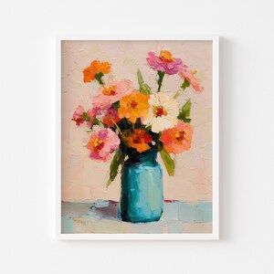 May include: A framed floral painting featuring a bouquet of colorful flowers in a turquoise vase. The flowers are in shades of orange, pink, and white, with green leaves. The artwork has a textured, impressionistic style, set against a neutral background.