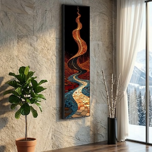 May include: Abstract mosaic art print in a black frame. The artwork features a winding river of blue, orange, and gold tones against a dark background. The piece is mounted on a textured stone wall, with a potted plant and window in the scene.