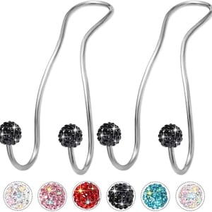 May include: Set of four silver-toned car seat headrest hooks. Each hook features a curved design with a decorative black crystal ball at the base. Additional crystal ball color options are shown below the hooks.