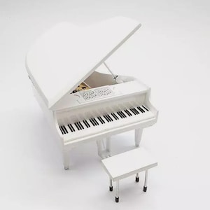 May include: A white grand piano with a matching bench. The piano's lid is open, revealing the keys and interior details. The keys are black and white. The piano and bench are set against a white background.