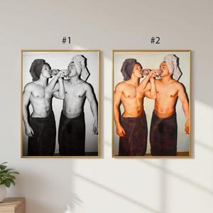 May include: Two framed prints. The first is a monochrome image of two people, each wrapped in a towel, drinking from a glass. The second print is a colour version of the same image. The prints are labelled #1 and #2.
