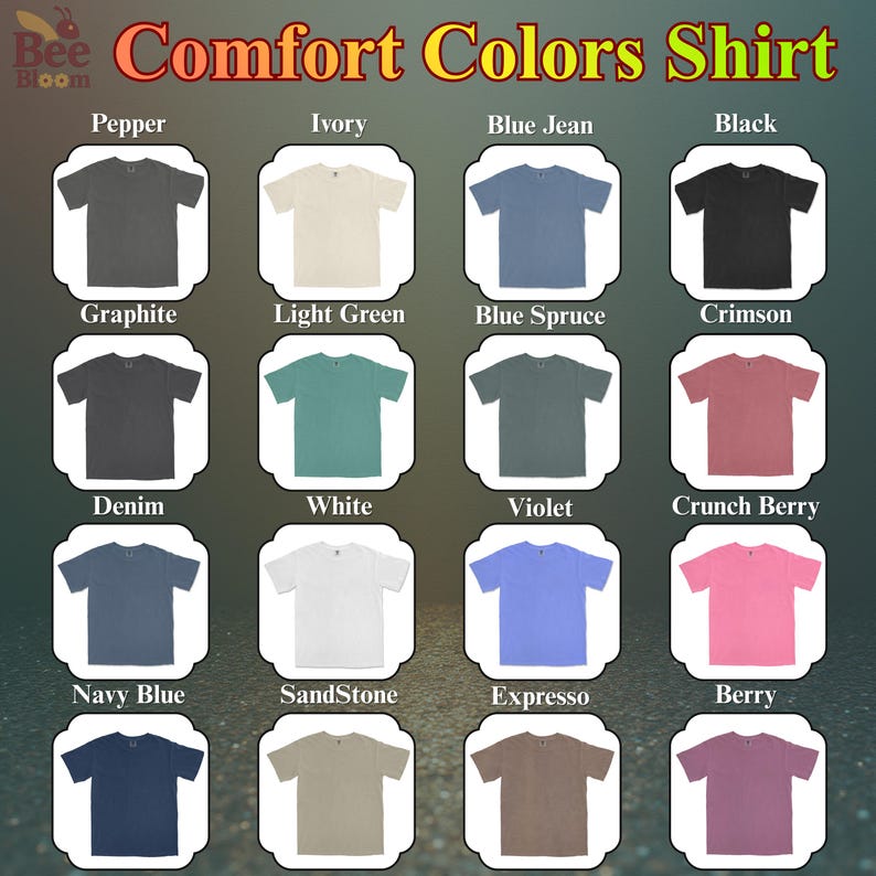 May include: A display of Comfort Colors shirts in various colors, including Graphite, Ivory, Blue Jean, and Black. Each shirt is neatly presented, showcasing the range of available hues. The text "Comfort Colors Shirt" is at the top.