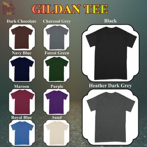 May include: A product image showcasing Gildan brand t-shirts in various colors, including dark chocolate, charcoal grey, black, navy blue, forest green, maroon, purple, royal blue, sand, and heather dark grey. The text "GILDAN TEE" is displayed at the top.