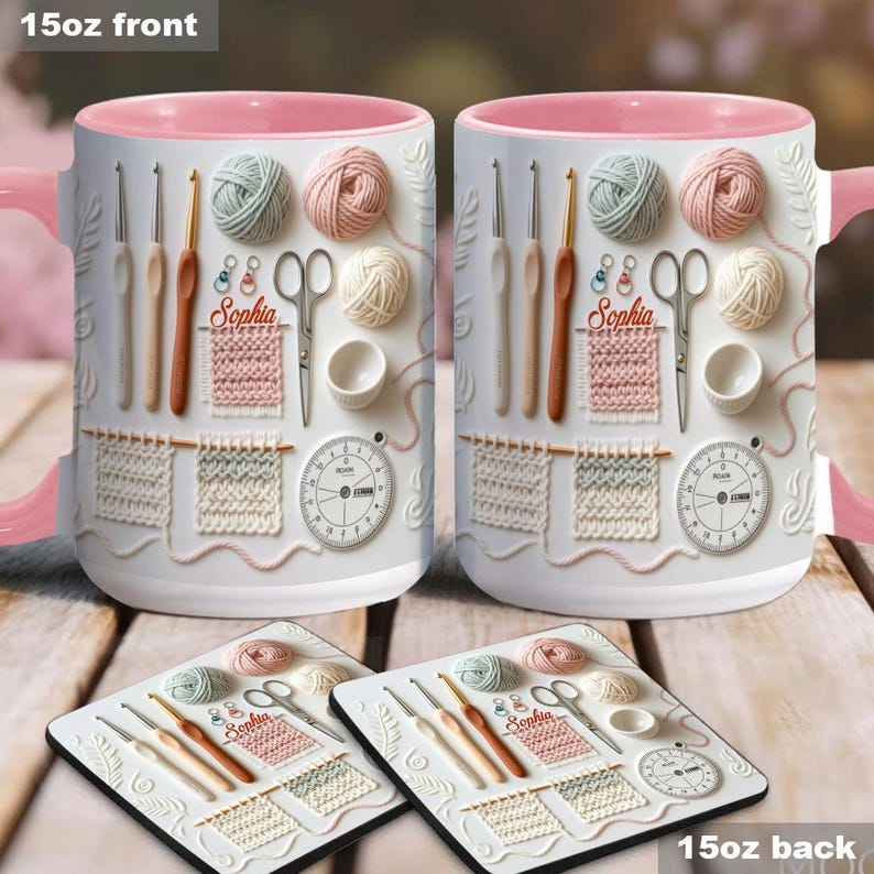 May include: Two white ceramic mugs with pink interiors and handles, featuring a 3D design of knitting tools, yarn, and a timer. The mugs have the name "Sophia" on them. Two matching coasters are also visible, with the same design.