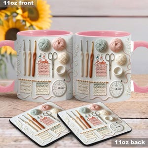 May include: White ceramic mugs with pink interiors and handles, featuring embossed knitting and crochet tools, yarn balls, and the name "Sophia." Matching coasters with the same design are also visible. The text "11oz front" and "11oz back" are displayed.