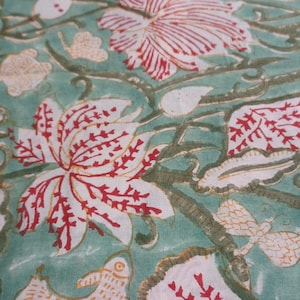 Green floral hand block print cotton fabric
Beautiful Handcrafted Floral Cotton Fabric with Red Lotus Flowers, Botanical Vines and Green Background, Ideal for Boho Home Decor, Cottagecore Sewing, Quilting and Handmade Textile Projects.
Soft Lightweight Hand Block Print Fabric made from Premium Indian Cotton featuring Vintage Red Floral Pattern and Botanical Leaf Design for Dresses, Skirts, Blouses, Quilts and DIY Sewing Projects.