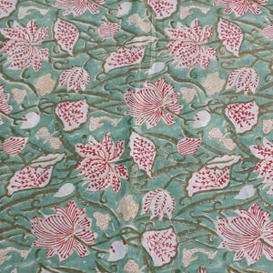Indian botanical block print fabric by yard
Vintage Style Indian Block Print Fabric featuring Red Lotus Flowers, Botanical Leaves and Nature Inspired Vine Design on Premium Cotton Fabric for Clothing, Bedding and Handmade Accessories.
Handmade Indian Botanical Cotton Fabric featuring Red Floral Lotus Blooms and Green Vine Pattern, Perfect for Sewing Dresses, Table Runners, Napkins, Tote Bags and Quilting Projects.