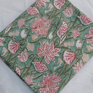 Decorative Indian cotton fabric for curtains and pillows
Traditional Handmade Block Print Fabric with Elegant Red Flowers, Botanical Leaves and Vintage Vine Pattern on Green Cotton Fabric for Dressmaking, Patchwork, Quilts and Farmhouse Home Decoration.
Authentic Indian Cotton Fabric by the Yard featuring Hand Block Printed Floral Lotus Motif, Nature Inspired Botanical Design for Sewing Apparel, Tablecloths, Pillow Covers and Interior Decorating.