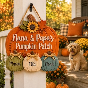 May include: A decorative wooden pumpkin sign featuring the text Nana & Papa's Pumpkin Patch, adorned with a sunflower and maple leaves. Three smaller pumpkins in green, cream, and blue are attached, each personalized with the names Mason, Ella, and Noah.