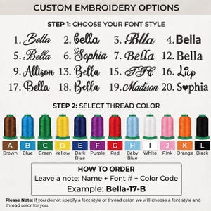 May include: A custom embroidery options chart displaying twenty numbered font styles and twelve coloured thread spools labelled A through L, including brown, blue, green, yellow, dark blue, purple, red, baby blue, white, pink, orange, and black.