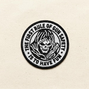 May include: A set of three ceramic mugs with a speckled, matte finish. The mugs are in shades of cream, light gray, and dark gray. Each mug has a simple, minimalist design and a rounded handle.