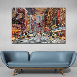 May include: A large canvas print depicting a snowy New York City street scene with superheroes in action. Buildings line the street, with signs for a theater and a hotel. The sky is a mix of orange and purple.