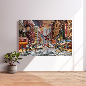 May include: A canvas print depicting a dynamic street scene in New York City, featuring superheroes in action. The artwork showcases a vibrant cityscape with buildings, cars, and pedestrians. The words "NOW PLAYING" and "HOTEL NEW YORK" are visible.