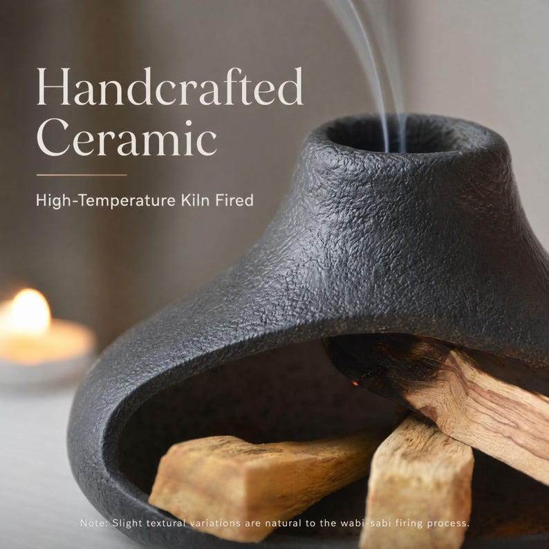 May include: Handcrafted ceramic incense holder, black with a textured surface. The holder has a unique shape with an opening at the top where smoke is rising. Palo santo wood pieces are inside. Text on the image reads "Handcrafted Ceramic" and "High-Temperature Kiln Fired."