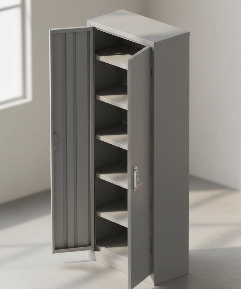 May include: A gray metal storage cabinet with two doors, one open to reveal multiple shelves. The cabinet is rectangular and stands upright. The doors have a vertical ribbed design and a handle. The cabinet is in a room with a window.