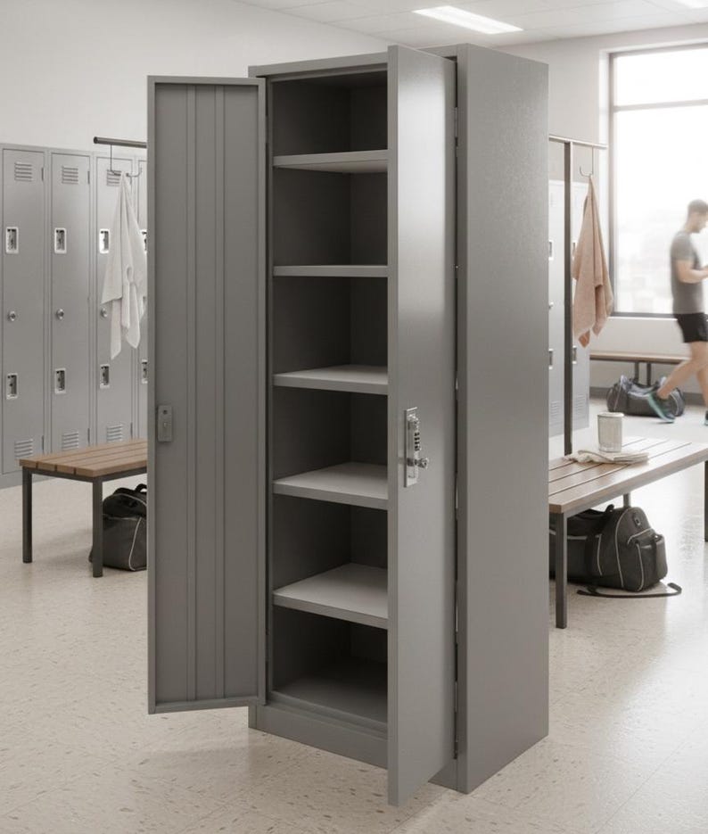 May include: A gray metal locker with the door open, revealing four shelves. The locker has a combination lock and is in a gym or locker room setting. Other lockers and benches are visible in the background.