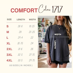 May include: A Comfort Colors 1717 t-shirt size chart displaying length and width measurements in inches for sizes S through 4XL. The chart includes a visual guide on a charcoal grey t-shirt showing how to measure length and width.
