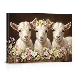 May include: A canvas print featuring three white goats with smiling faces. The goats are positioned behind a wooden fence adorned with pink, white, and yellow flowers. One goat wears a floral crown. The background is a dark brown.