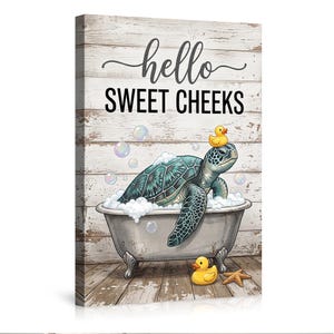 May include: A canvas print featuring a teal sea turtle in a vintage bathtub filled with bubbles. The turtle has a rubber ducky on its head. The words "hello SWEET CHEEKS" are written above the turtle. A starfish and a rubber ducky are also in the image.