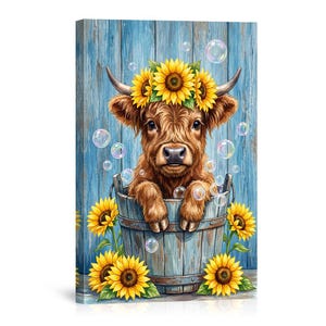 May include: A canvas print featuring a brown Highland cow calf in a wooden bucket, adorned with a sunflower crown. Bubbles float around the calf, and sunflowers are placed around the bucket. The background is a blue wooden wall.