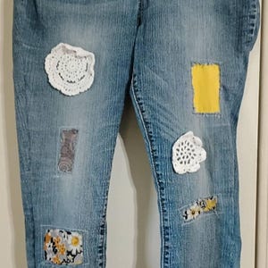 Upcycled Levi denim capris with flower ruffle. Size 12 stretch 24" Inseam