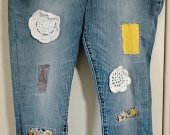 Upcycled Levi denim capris with flower ruffle. Size 12 stretch 24" Inseam