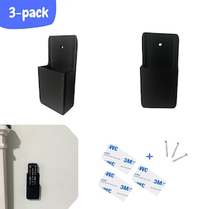 May include: A 3-pack of black remote control holders. The holders are rectangular with a small hole at the top for mounting. Also included are 3M double-sided tape, screws, and a remote control.