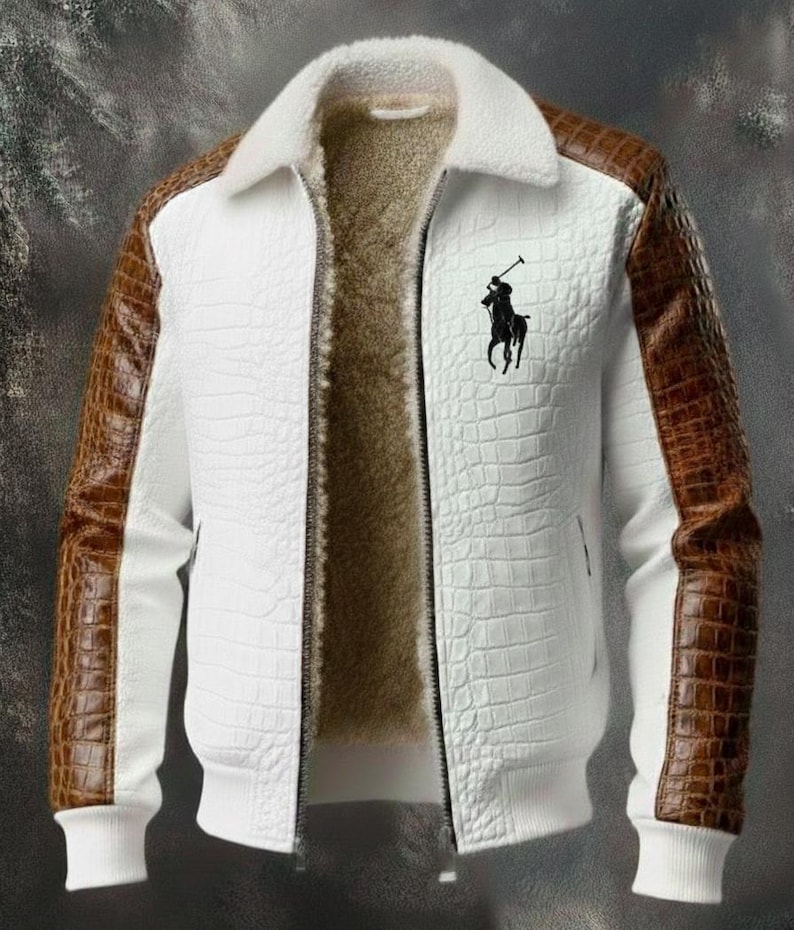 May include: White jacket with brown faux-leather sleeves and a white faux-fur collar. The jacket features a textured pattern and a black logo on the chest. The interior is lined with a soft, brown material. A stylish outerwear piece.