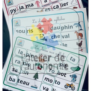 May include: Three educational activity sheets titled La chasse aux syllabes featuring French words broken into syllables with corresponding illustrations like a pineapple, dolphin, horse, tree, robot, motorcycle, and suitcase on white paper.