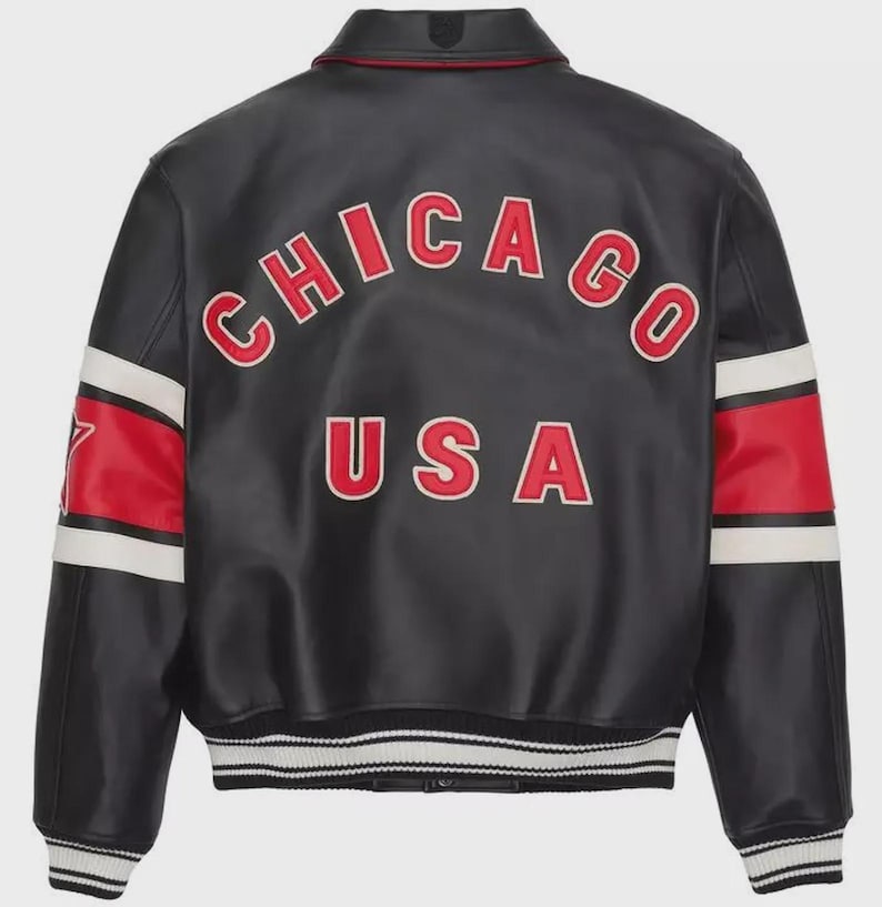 May include: Black leather jacket with red and white accents. The back features the word "CHICAGO" arched across the top and "USA" below, in red lettering with white outlines. White stripes and red panels adorn the sleeves.