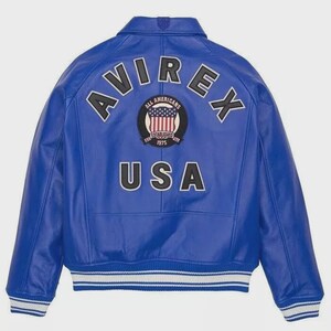 May include: A vibrant blue leather jacket with the word "AVIREX" arched across the shoulders. Below the word "AVIREX" is a circular patch with the words "ALL AMERICANS ESTABLISHED 1975" and a USA flag design. The word "USA" is printed below the patch.