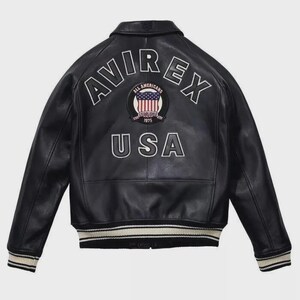 May include: Black leather jacket with the text "AVIREX" and "USA" on the back. The jacket features a patch with the American flag and the words "ALL AMERICANS ESTABLISHED 1975". The jacket has a ribbed collar, cuffs, and hem.
