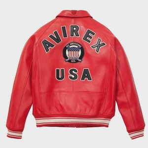 May include: A red leather jacket with the word "AVIREX" arched across the shoulders in black and white lettering. Below the word "AVIREX" is a circular patch with the words "ALL AMERICANS" and a US flag design. The word "USA" is printed below the patch.
