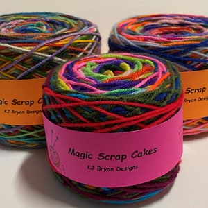 May include: Three colourful yarn cakes with the label "Magic Scrap Cakes KJ Bryan Designs".