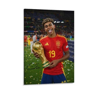 May include: A poster featuring a soccer player in a red jersey with the number 19 and the Spanish national team crest, holding a gold trophy. The player has curly hair and is sticking their tongue out. A black signature is visible on the trophy.