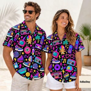 May include: Two short-sleeved button-down shirts featuring a vibrant black background with a repeating 1990s-inspired pattern. The print includes colorful boomboxes, roller skates, troll dolls, cassette tapes, and musical notes in neon hues.