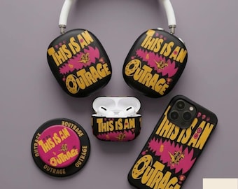 May include: A collection of black accessories with the phrase "THIS IS AN OUTRAGE" in yellow and pink. Includes headphones, a phone case, an Airpods case, and a button. The headphones have a white headband.