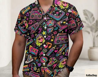 May include: A short-sleeve button-down shirt with a black background featuring a vibrant, multi-colored 1980s-themed print. The pattern includes illustrations of boomboxes, cassette tapes, microphones, disco balls, electric guitars, and sneakers.