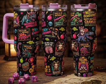 May include: Three black stainless steel tumblers with light purple lids and handles, featuring a colorful graphic print of dinosaurs, goats, cats, skulls, bombs, and text including "MONGO IS APPALLED," "NEW ACHIEVEMENT," and "NEEEEEW ACHIEVEMENT! HAPPY BIRTHDAY CRAWLER."