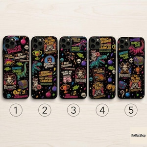 May include: Five black smartphone cases featuring colorful Dungeon Crawler Carl themed graphics, including illustrations of a goat, a dinosaur, a treasure chest, and text such as 'New Achievement', 'This is an outrage', and 'Prepotente'.