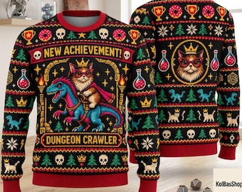 May include: A black long-sleeve sweater with a red collar, cuffs, and hem. The front features a cat wearing a crown and glasses riding a blue dinosaur, with the text NEW ACHIEVEMENT and DUNGEON CRAWLER. The pattern includes skulls, trees, and potions.