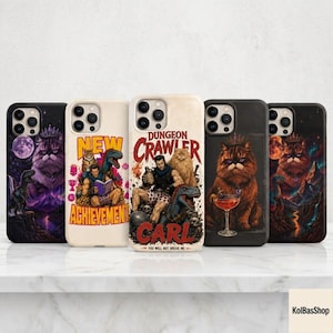 May include: Five smartphone cases featuring fantasy-themed illustrations of cats, dinosaurs, and adventurers. Designs include a cat with a crown, a character reading a book titled New Achievement, and a character labeled Dungeon Crawler Carl.