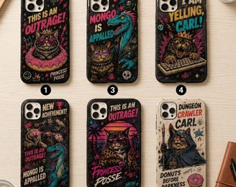 May include: Six smartphone cases featuring graphic illustrations. Designs include cats wearing crowns, a dinosaur, and text such as 'This is an outrage!', 'Mongo is appalled', 'I am yelling, Carl!', 'New achievement', 'Princess Posse', and 'Dungeon Crawler Carl'.