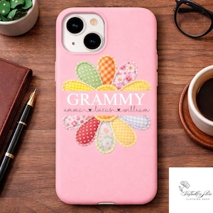 May include: Pink phone case with a daisy design. The daisy has colorful petals and the word "Grammy" in white, with names below. The case is for an iPhone.