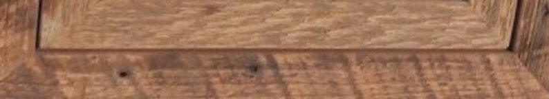 May include: Close-up of a wooden surface with a natural wood grain pattern. The wood has a rustic, weathered look with knots and imperfections.