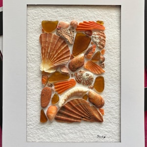 Sea glass and shell art - orange. Rectangle design. Black or white cardboard/ mount board window.